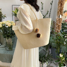 Load image into Gallery viewer, IOKE #2 Large women's straw beach tote with PomPom charms