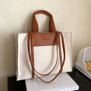 KAZUKO Tote Bag that Features a Classic Canvas Design and Leather Double Shoulder Straps with Double Handles