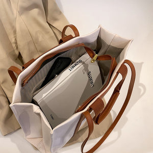 KAZUKO Tote Bag that Features a Classic Canvas Design and Leather Double Shoulder Straps with Double Handles